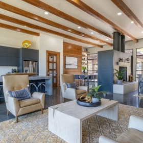 Find your perfect fit at The Pradera a living room with a large glass ceiling