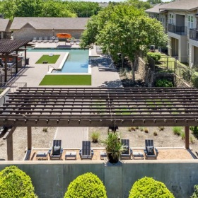 The essence of exceptional living a building with a deck and chairs