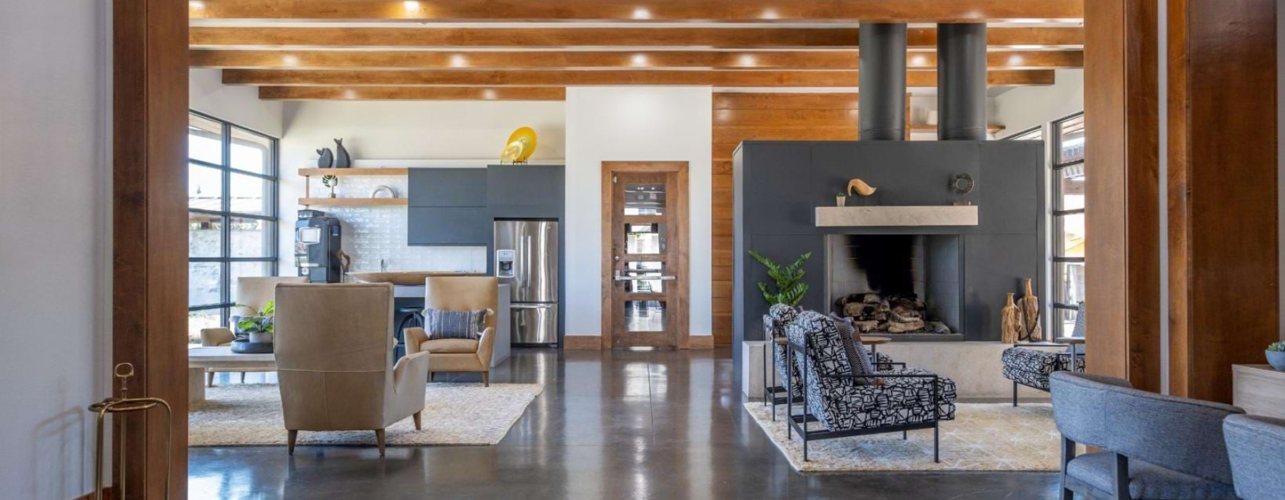 a large living room with a fireplace
