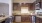 a kitchen with wooden cabinets